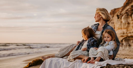 Scout Fine owner Julie with twin daughters on the beach.